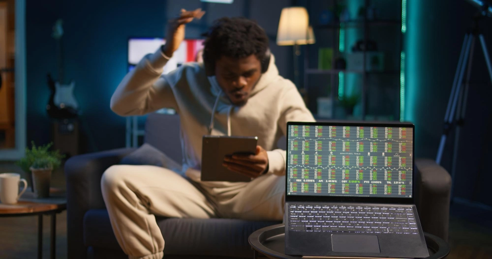 African american person using his tablet laying couch